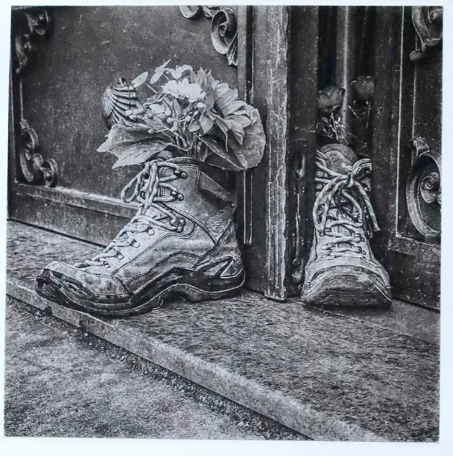 A pair of boots stands sentinel in a doorway